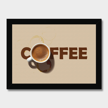 Framed wall art featuring a coffee cup and the word "COFFEE" in large brown letters on a beige background, shown in a black frame against a light gray wall.