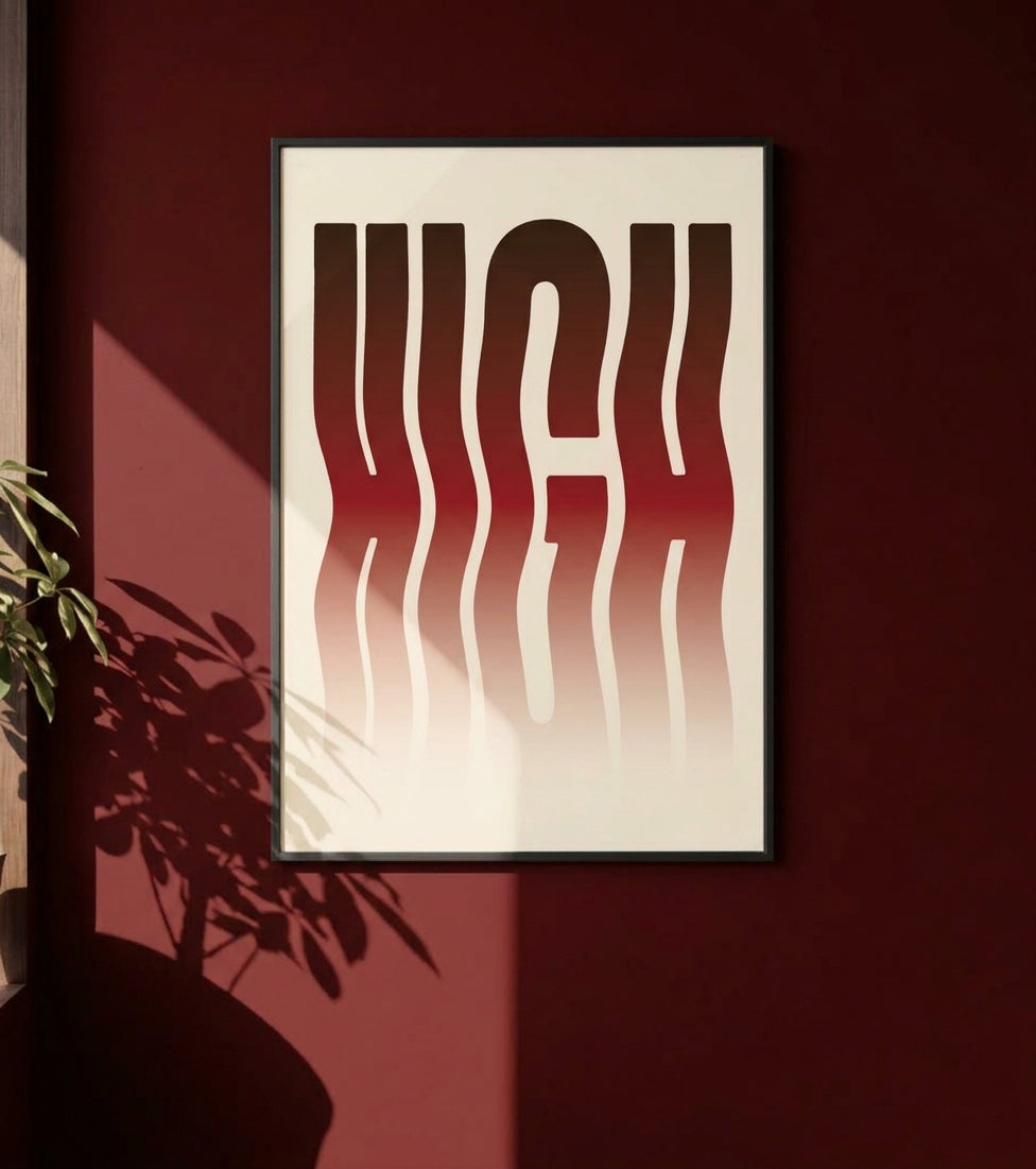 A framed wall art print featuring stylized wavy lettering in a red-to-cream gradient, hanging on a dark burgundy wall with plant shadows cast across it.