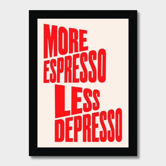 Framed typographic wall art with the phrase “MORE ESPRESSO LESS DEPRESSO” in large red letters on a warm off-white background, shown in a black frame against a light gray wall.
