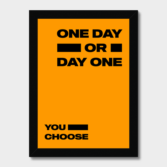 Framed poster with 'One Day or Day One You Choose' text on an orange background