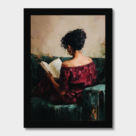Framed painting of a woman in a red dress reading a book on a couch.