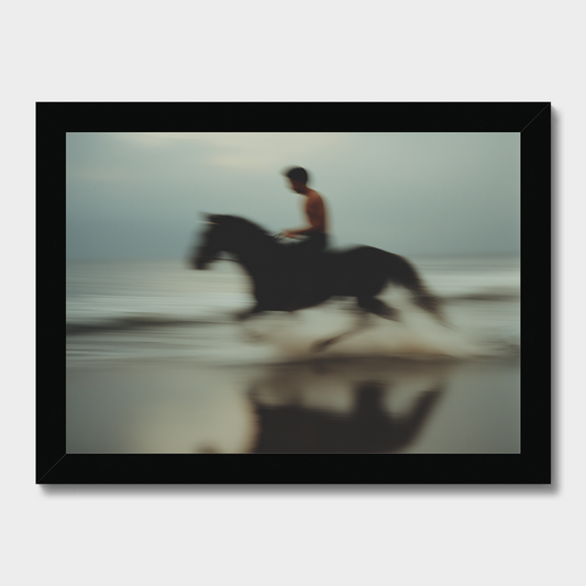 Person riding a horse on a beach with a blurred effect