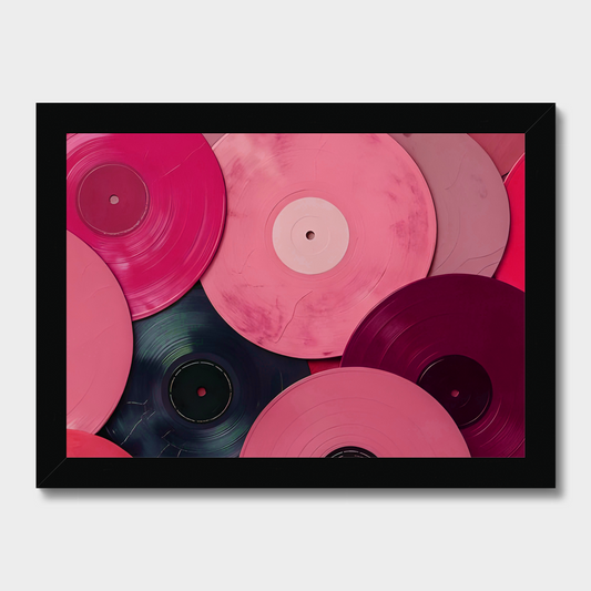 Framed artwork of pink and red vinyl records on a white background